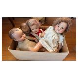 Box slot of four antique doll babies, One has an