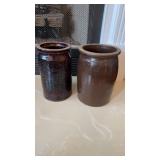 2 antique stoneware crocks, both with a brown