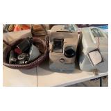 Two vintage cameras and a vintage slide projector
