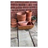 Collection of larger clay pots that includes four
