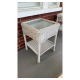 Square white wicker side table with a wicker