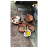 Group of flowerpots, includes four larger clay