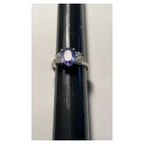 1 marked 14 K gold ring with light purple blue