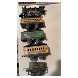 Five car antique train set, with a wind up iron