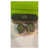 Two baby brushes with sterling silver tops, and a