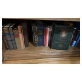 One shelf of vintage books, including the life of