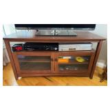 Two glass door cabinet stand, currently has TV on