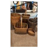 5 baskets, and one gold fleck trashcan or flower