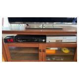 2 VHS and DVD players, one by Phillips and one