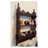 Three level whatnot shelf, heavily carved,