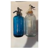 2  vintage seltzer water bottles, one is a blue