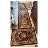 Three carpet rugs, two doormats that are about 3
