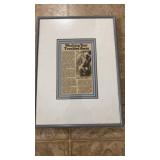Framed and double matted paper article titled