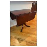 Antique drop leaf dining room table, with brass