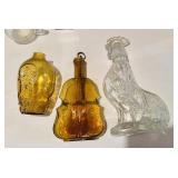 Clear glass molded rooster bottle with a rooster,