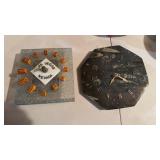 Two clocks, one fossilized stone polished on the