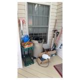 Miscellaneous garden tool lot on the back porch,