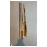 Two fishing poles with cork handles, the two