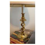 Brass base table lamp with a pleaded white shade