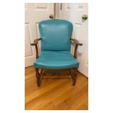 Armchair with a turquoise vinyl seat and back,
