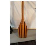 Antique canoe, paddle, with stripes of different