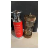 2 vintage cocktail shakers, one shape like a fire
