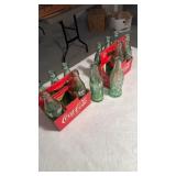 26 packs Coca-Cola bottles, six bottles from