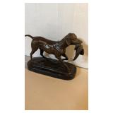 Heavy vintage bronze, dog sculpture on a black