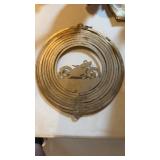 Vintage brass motorcycle, nine cut circles that