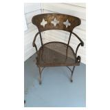 Heavy iron chair with a metal mesh seat, very