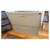 Small two drawer metal file cabinet, in the
