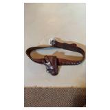 Vintage leather gun, holster, and belt, with some