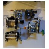 Five vintage fishing rails, including a phantom