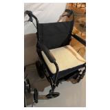 Folding wheelchair, with two handbrakes on the