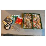 Box of fly fishing hooks, and some salt water
