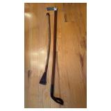 2 two horse riding crops, one with the Sterling