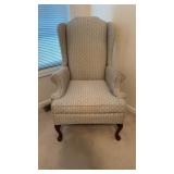 Wing back chair, with signs of wear and dirt,