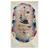 Small oval antique Chinese carpet rug with an