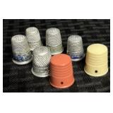 7 Vintage Advertising Thimbles - Various Materials