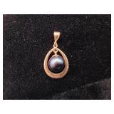 14K Gold Pendant with a Black Pearl.