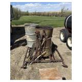 Metal Frame on Skids w/ Burning Barrels