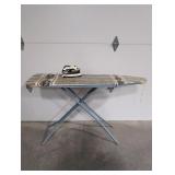 Metal ironing board with Black and Decker iron