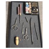 8 large hand sewing needles and 2 scissors