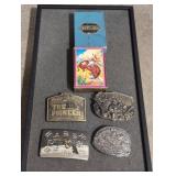 4 western belt buckles and deck cards