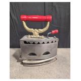 Antique coal iron and base, red wood handle