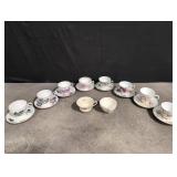 Pretty assorted tea cups with saucers
