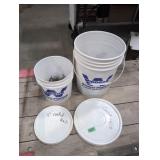Five gallon pail 2/3 full of 3' coated nails, two