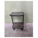 Black metal and smoked glass rolling table 16' w