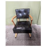 Vintage wooden spring chair with vinyl covering