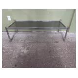 Aluminum table with glass top 53' w x 21' d x 1